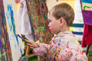 Little boy in art class